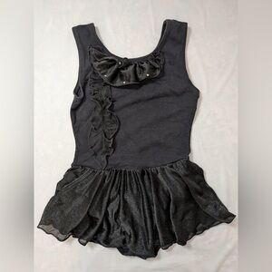 Free style Danskin, black dance leotard with an attached black skirt. Size 6